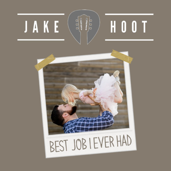 Jake Hoot holding daughter in the air